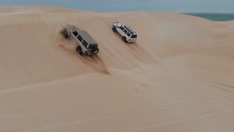 cars are driving on dunes and get stuck at geraldton western australia, aerial