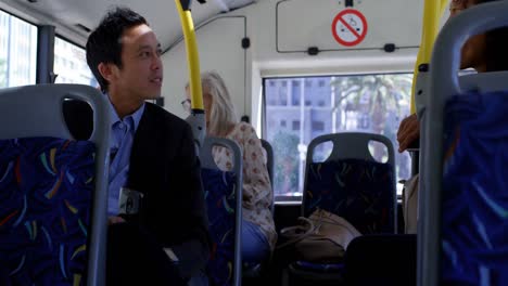 Commuters-interacting-with-each-other-while-travelling-in-bus-4k