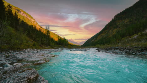 mountain river in austria alps with vibrant autumn evening sky