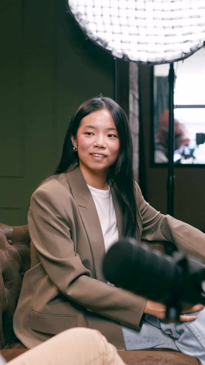 Young Asian Woman Participating in a Podcast Interview