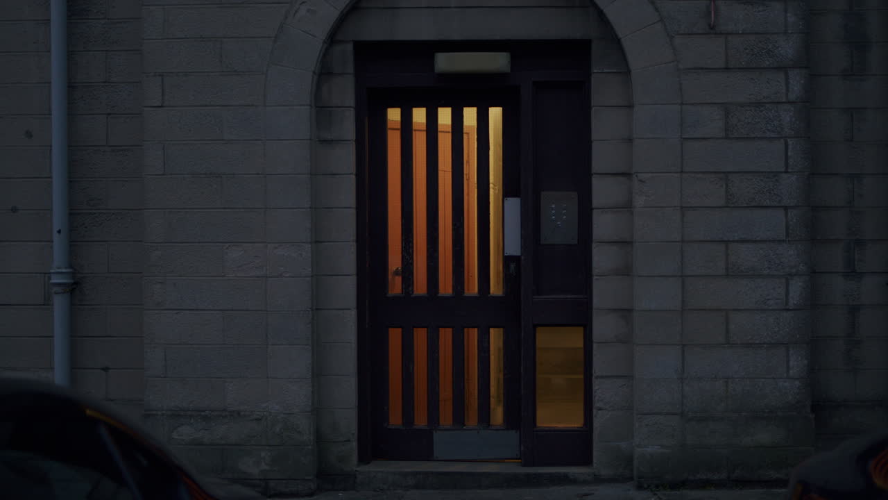 Late night shot of metal doors of a building with a code lock