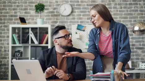 business colleagues working together on laptop