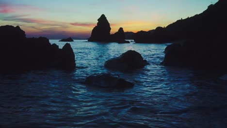 dark rocky beach on south of spain