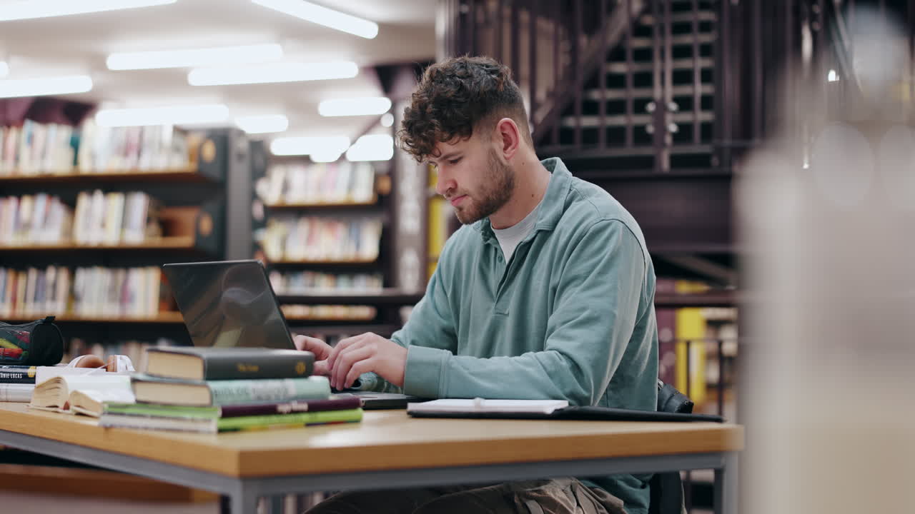 Student Working on Laptop in Library