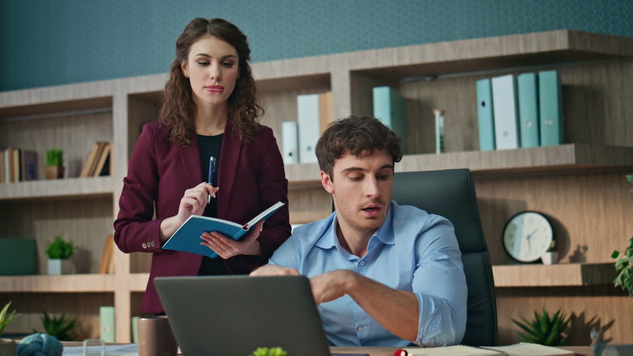 Two colleagues brainstorming office. Confident businessman planning workflow