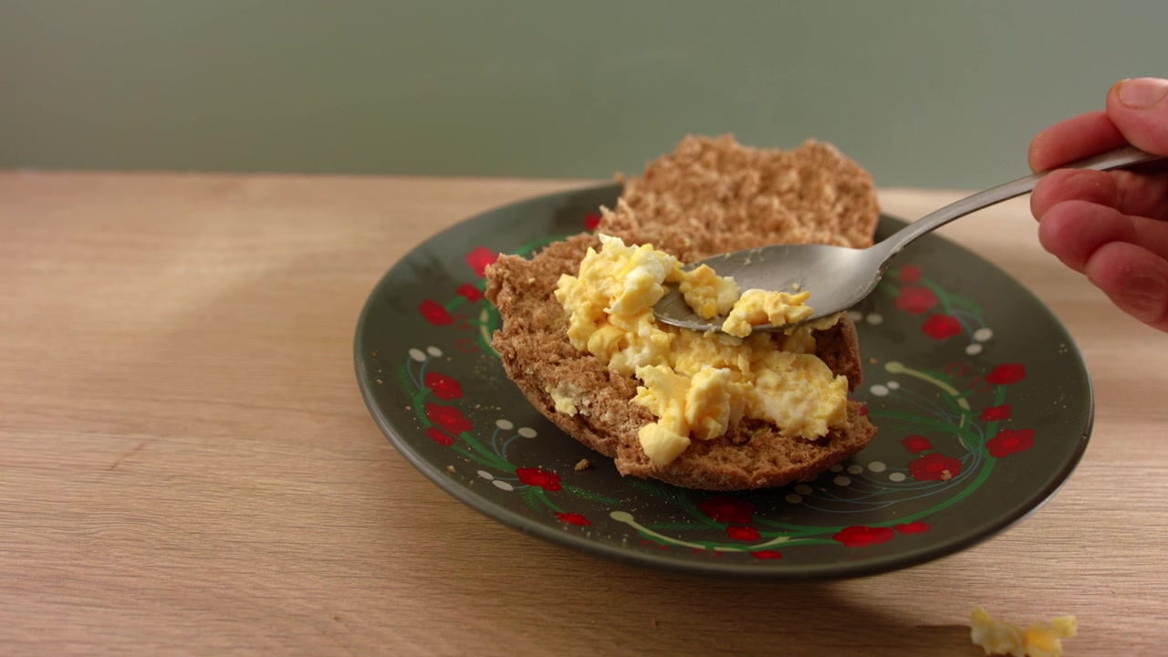 Making egg mayonnaise sandwich slow motion 4k medium shot selective focus