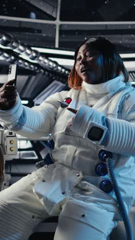 vertical video team of cosmonauts calibrating starship sensors using isolated screen monitor