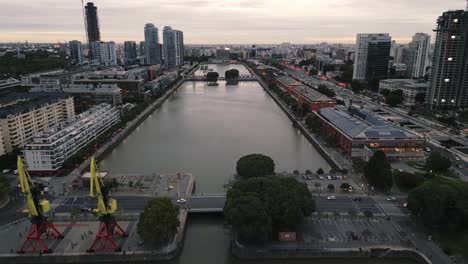 Aerial-Drone-Fly-Above-Puerto-Madero-Commercial-Area-and-Warehouses,-Argentine-Famous-Business-District-in-Buenos-Aires-City-at-Dusk