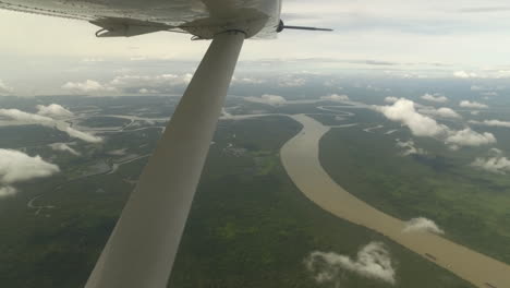 flying above the jungle in small airplane