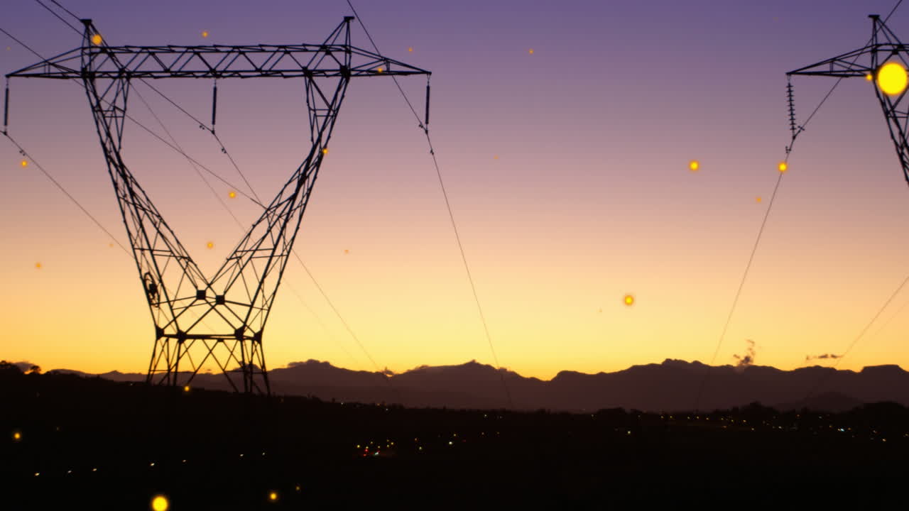 Animation of lens flares over transmission tower against silhouette of mountains