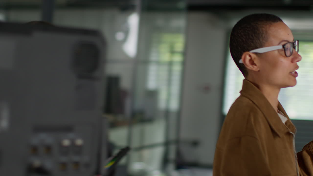 Frustrated Female Film Director Watching Performance Of Actors On Monitor Shooting Movie Or Video In Studio