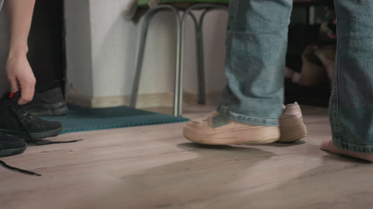 Quickly Arranging Footwear And Checking Belongings, Rapidly Organizing Shoes And Verifying Essentials Before Leaving, Hastily Tidying Up Footwear And Confirming Necessary Items Before Departing