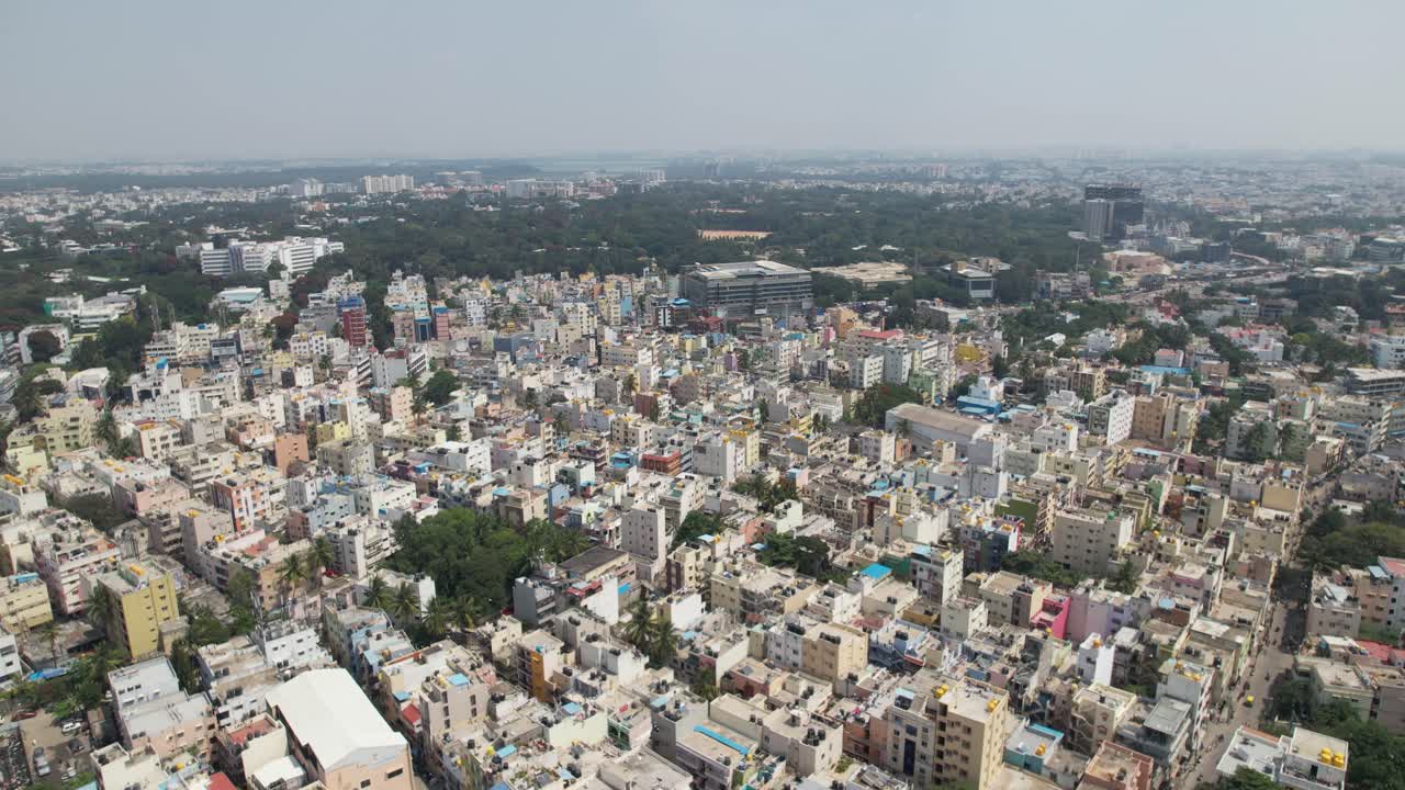 Dramatic aerial footage shows Bengaluru, the capital of Karnataka, as a bustling residential neighbourhood surrounded by single-family homes and apartment buildings