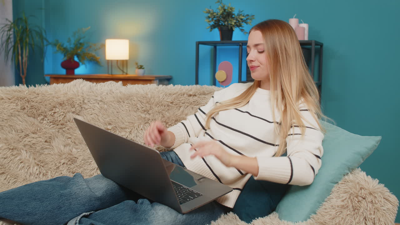 Caucasian woman exhausted on sofa after work no energy using laptop indoors lying feeling tired