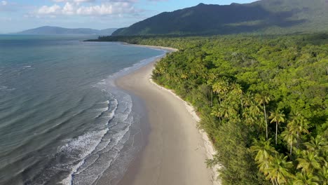 Cape-Tribulation-backward-aerial-of-sunny-Myall-beach,-in-Daintree-Rainforest,-Queensland,-Australia