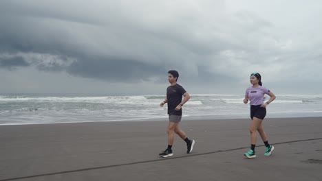 couple running on the beach