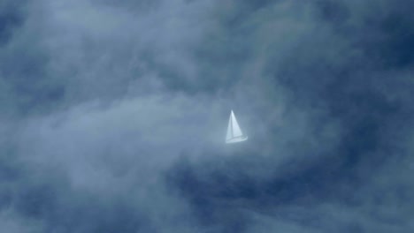 sailboat sailing on the calm ocean, aerial view airplane, thin clouds