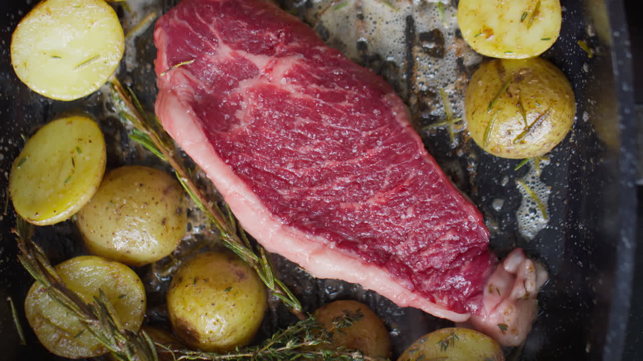 Steak and Potatoes being Cooked on Grill Pan
