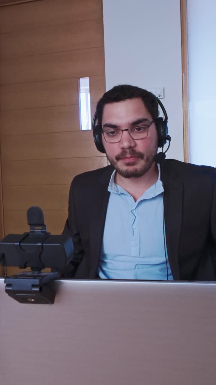 Man Engaged in a Serious Discussion During a Conference Call