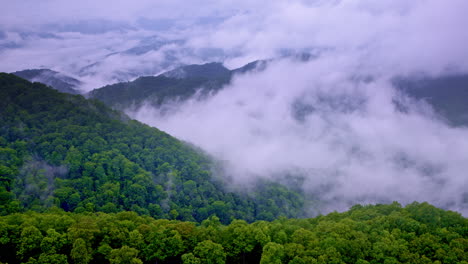 cloudlike mist hugs the ridges in this smoky mountain drone shot