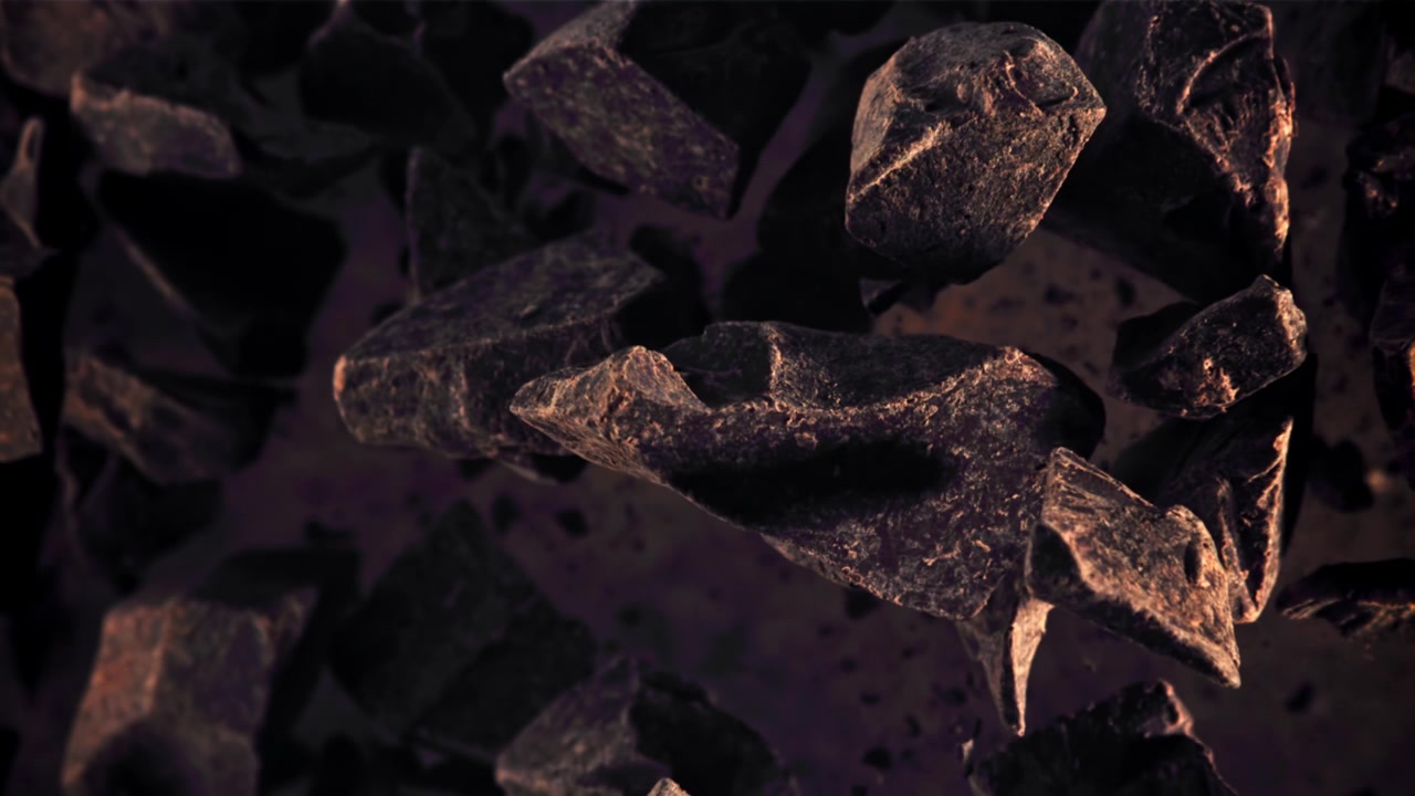 Dramatic Slow Motion of Dark Rocks and Glowing Particles