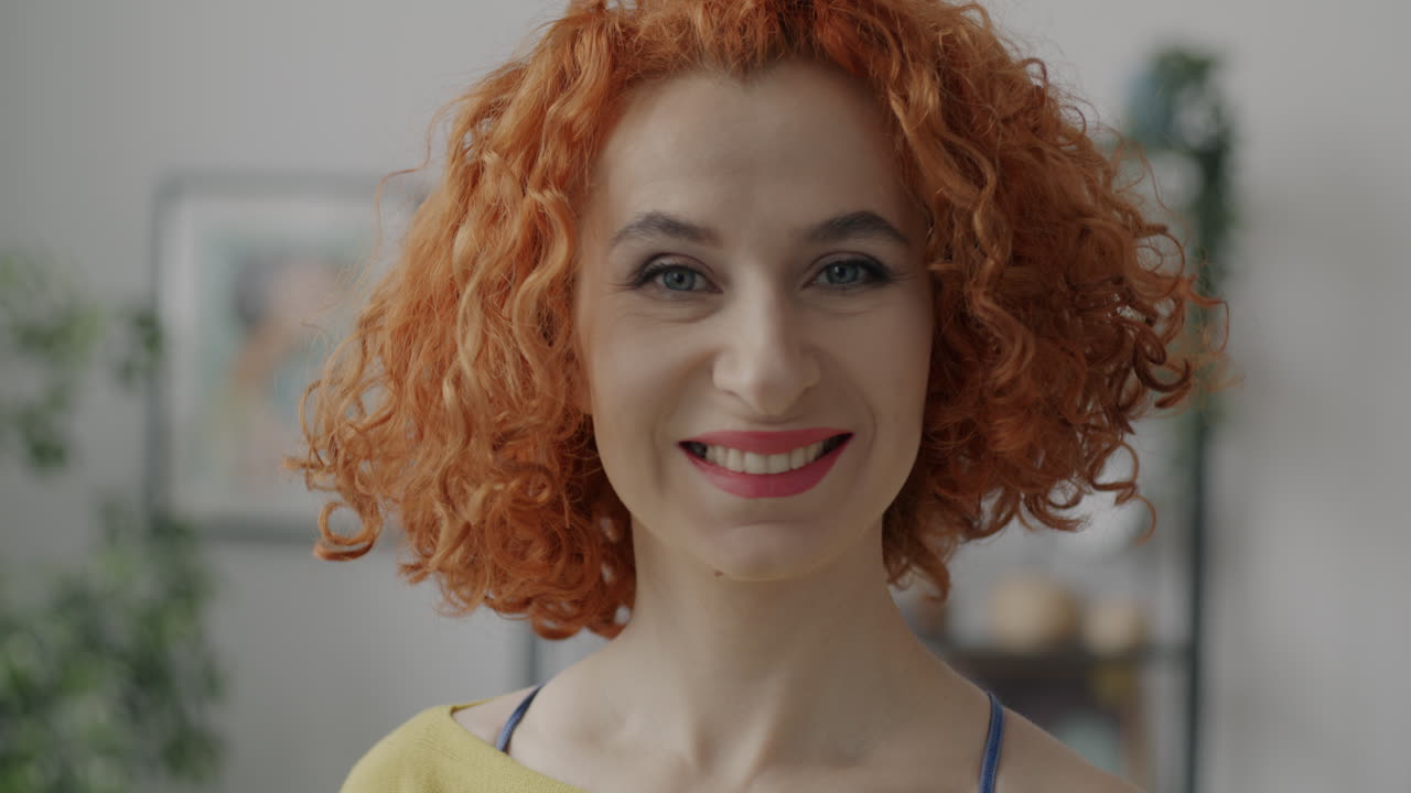 Happy Woman with Red Curly Hair