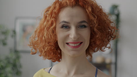 happy woman with red curly hair