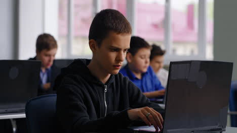 Students Working on Laptops in a Classroom