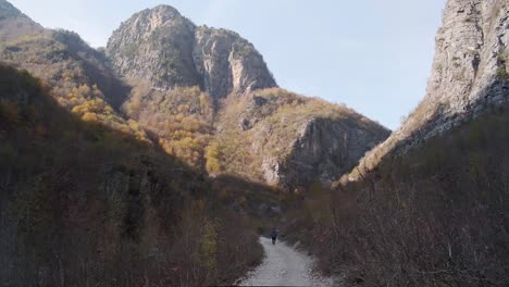 Hiking-around-Theth-to-the-Blue-Eye,-Grunas-waterfall-and-in-the-Albanian-Alps-during-Fall-season-or-autumn-season