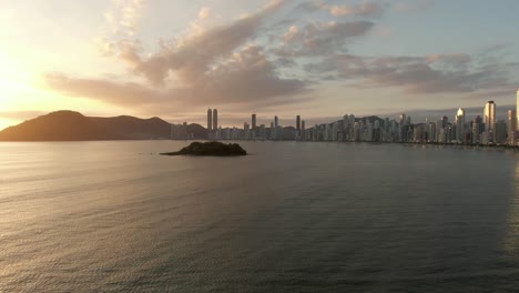 dramatic cityscape of balneário camboriú with ilha das cabras island in santa catarina, southern brazil