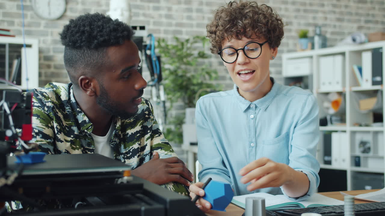 Students collaborating on 3D printing project