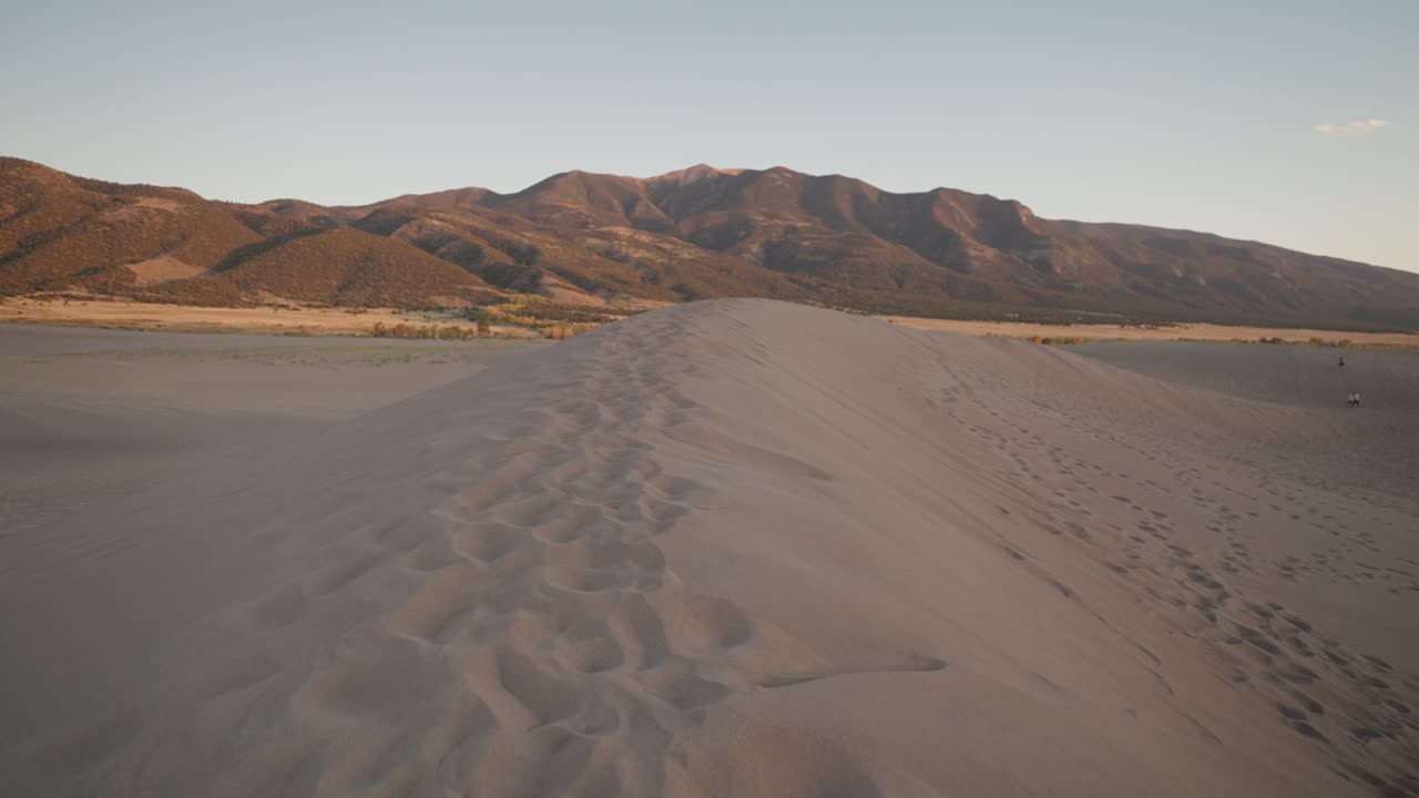 Sand Dunes and Mountain Landscape