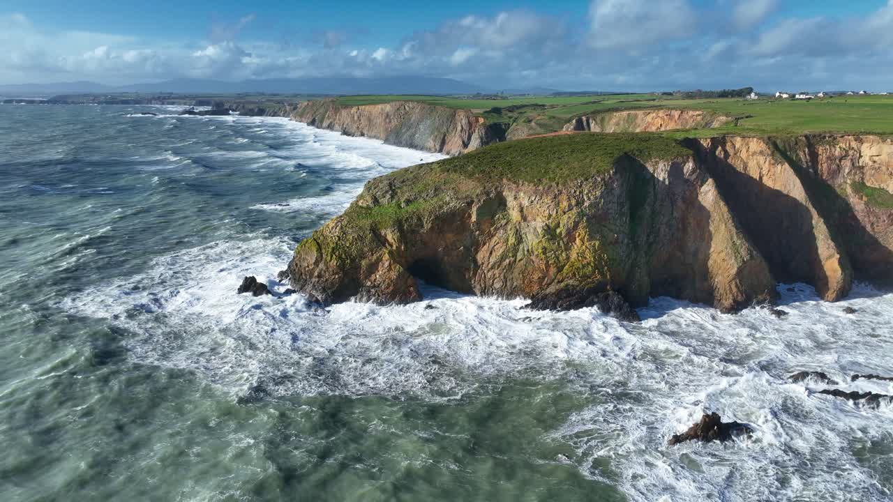 Ireland epic locations Waterford Coastline battered by winter storm boiling seas and waves crashing on fragile sea cliffs