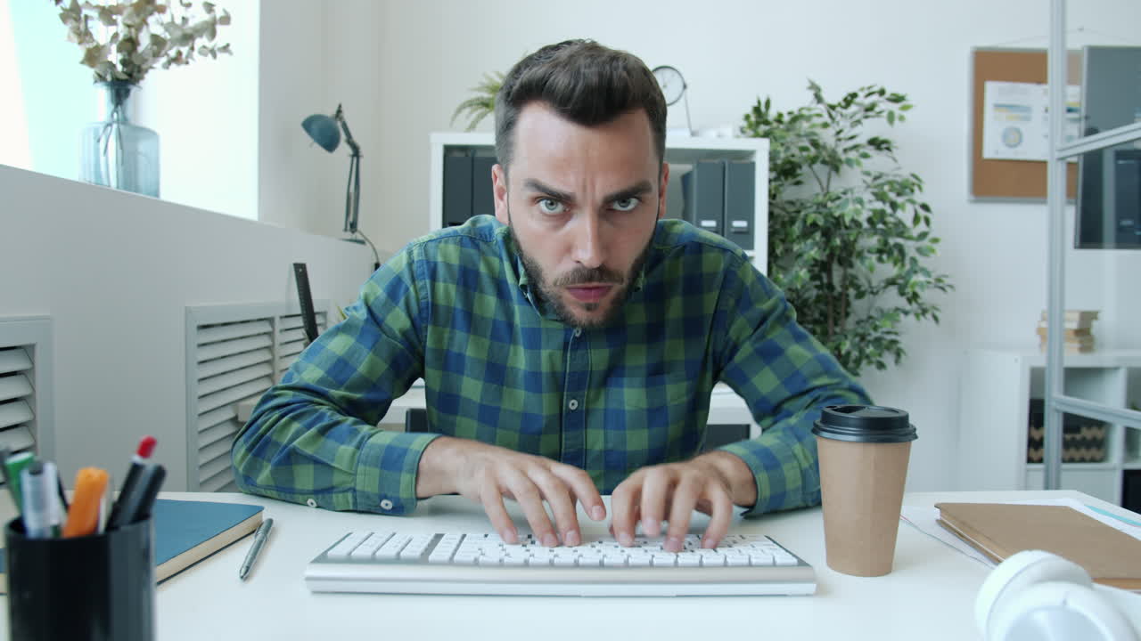 Shocked Employee Typing on Keyboard