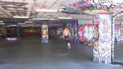 skateboarder performing tricks in urban skatepark