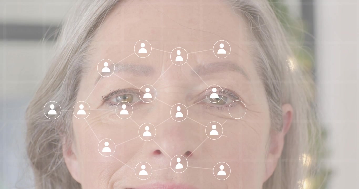 Senior woman touching temple summoning tech smartphone avatars binary code network map fading away