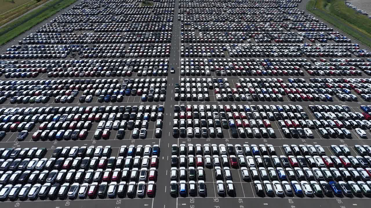 Industrial drone footage of Grimsby export terminal with vehicles, logistics operations, and dealership infrastructure England UK