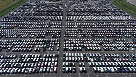 industrial drone footage of grimsby export terminal with vehicles, logistics operations, and dealership infrastructure england uk