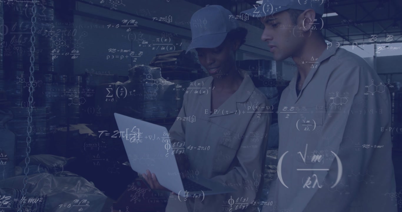 female and male workers angling laptop causing animated scientific formulas floating inside factory
