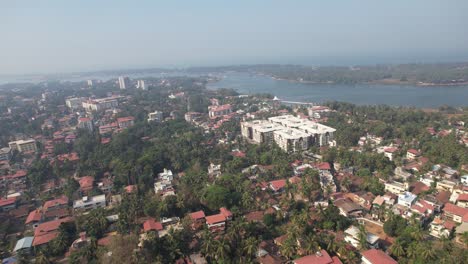 aerial view of the gurupura river in mangaluru, which is close to the sultan bathery ferry service and apartments and houses in the city