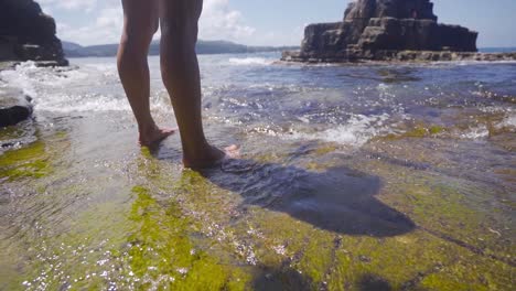 feet entering the sea in slow motion.