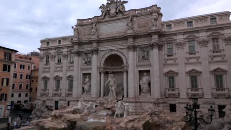 picturesque rising aerial of trevi fountain, close up view in the early morning cloudy day in rome, italy