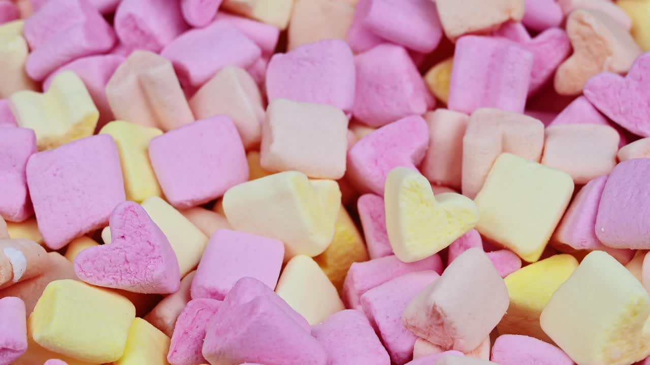 Young lovely couple relaxing head to head on the bed. Valentines day. Close up. Overhead view. Relationships and feelings concept. Slow motion