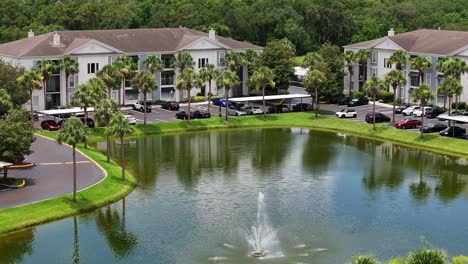 Suburban-neighborhood-with-neat-single-family-homes-and-private-pond-with-fountain