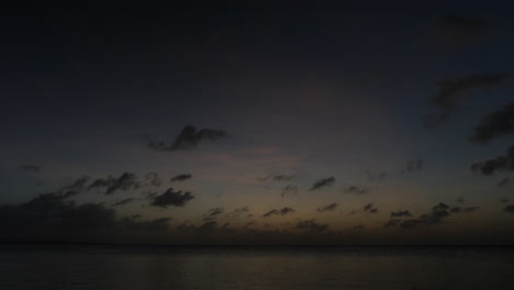 Time-lapse-of-clouds-at-sunset-along-beach-in-Saipan