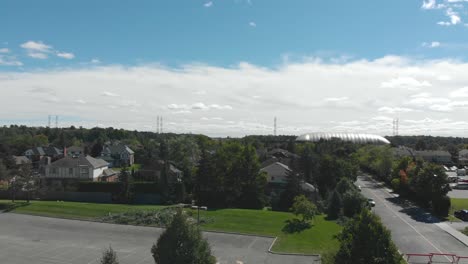 Rising-aerial-shot-over-a-small-city-outside-of-Ottawa-with-loads-of-traffic-due-to-a-power-outage-as-a-result-of-a-tornado