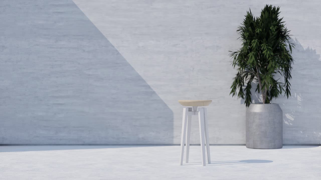 Modern minimalistisk pall och växt i betongmiljö.