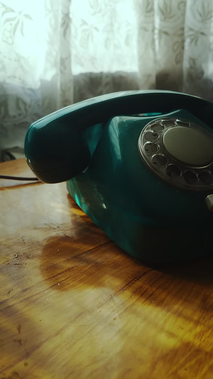 Ignoring cold caller on old rotary telephone then hanging up handset