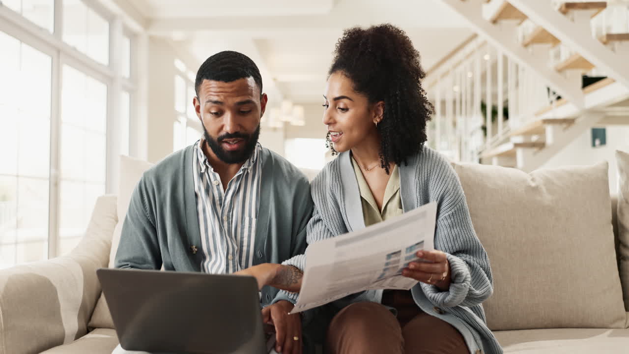 Couple reviewing finances at home