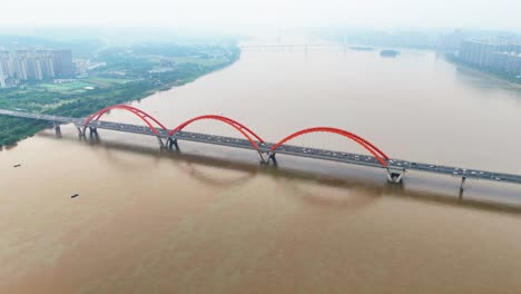 Aerial-shot-over-a-congested-bridge-at-rush-hour-into-Changsha-with-air-pollution